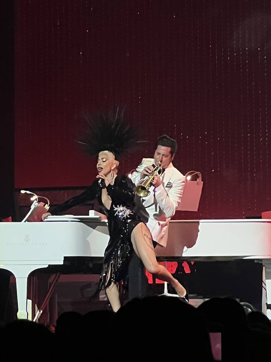 Lady Gaga is shown with trumpet player and bandleader Brian Newman at Dolby Live at Park MGM on ...