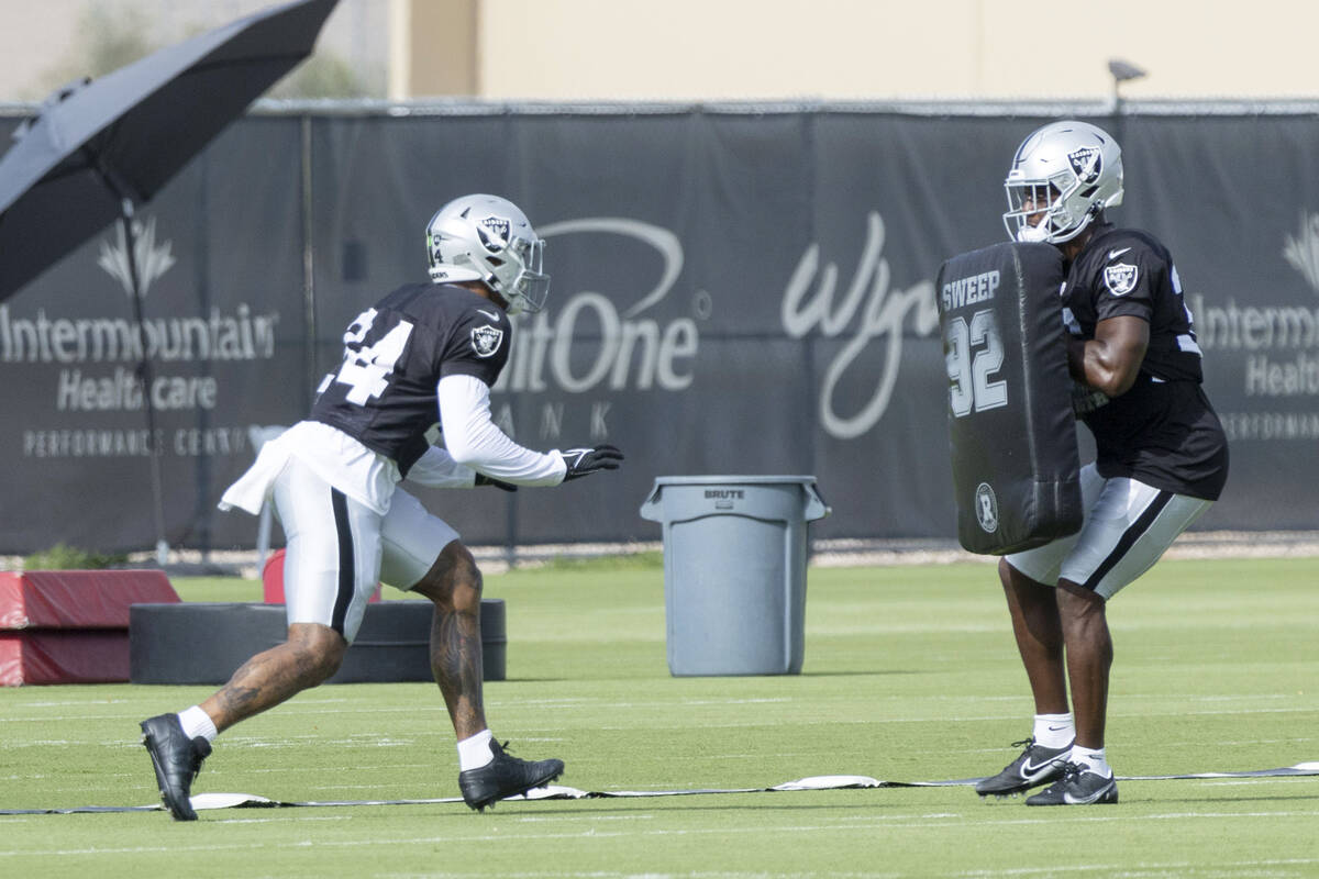 Raiders safety Johnathan Abram (24) drills with safety Duron Harmon (30) during the team&#x2019 ...