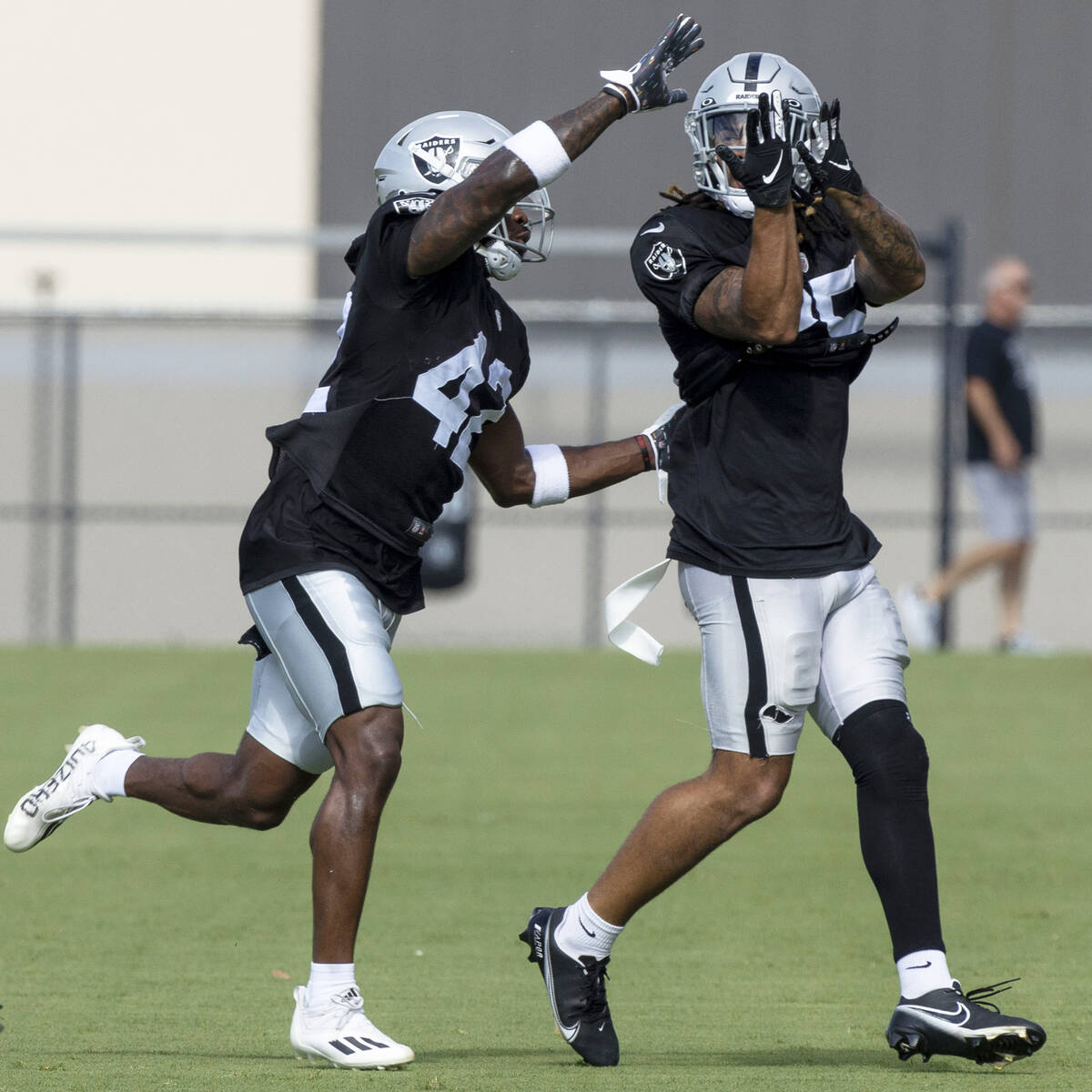 Raiders safety Qwynnterrio Cole (42) works with safety Tre'von Moehrig (25) during a drill at t ...