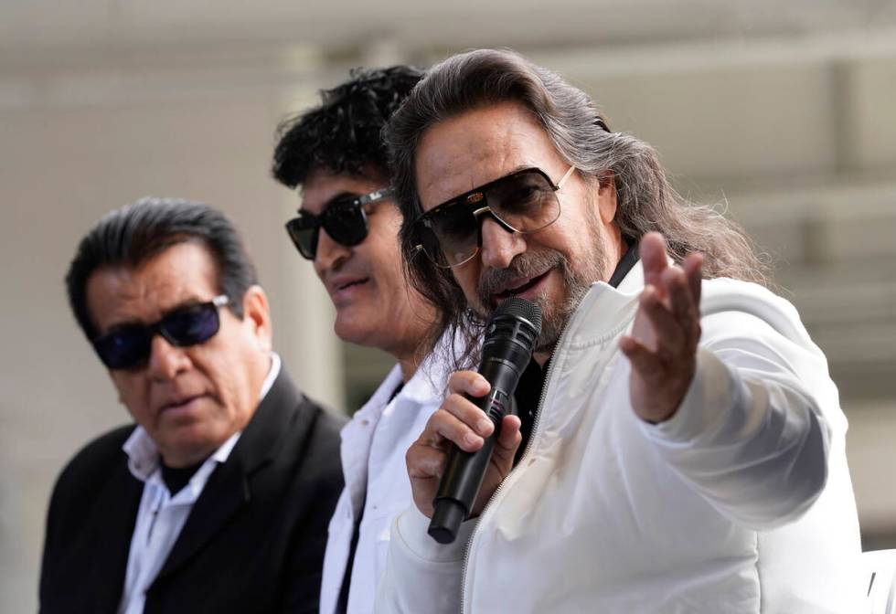 Members of the Mexican grupera band Los Bukis, from left, Pedro Sanchez, Roberto Guadarrama and ...