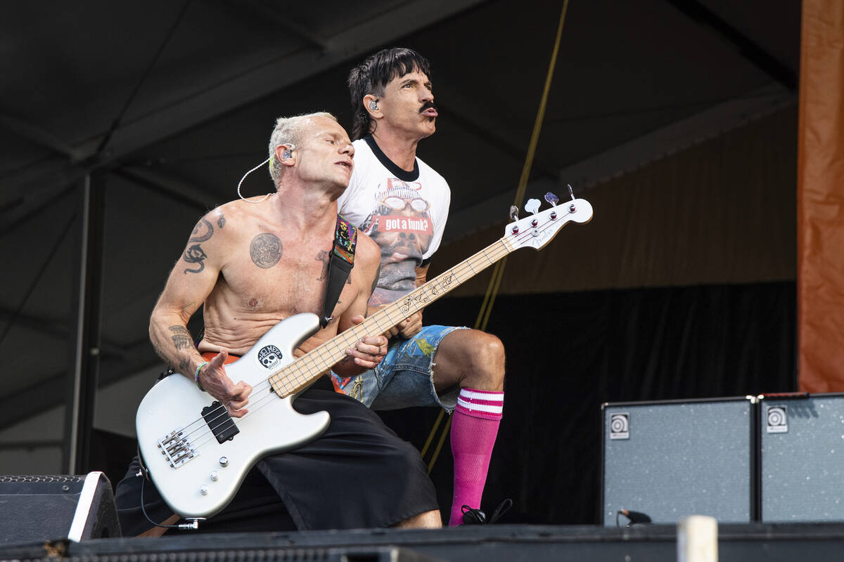 Flea, left, and Anthony Kiedis of the Red Hot Chili Peppers perform at the New Orleans Jazz and ...