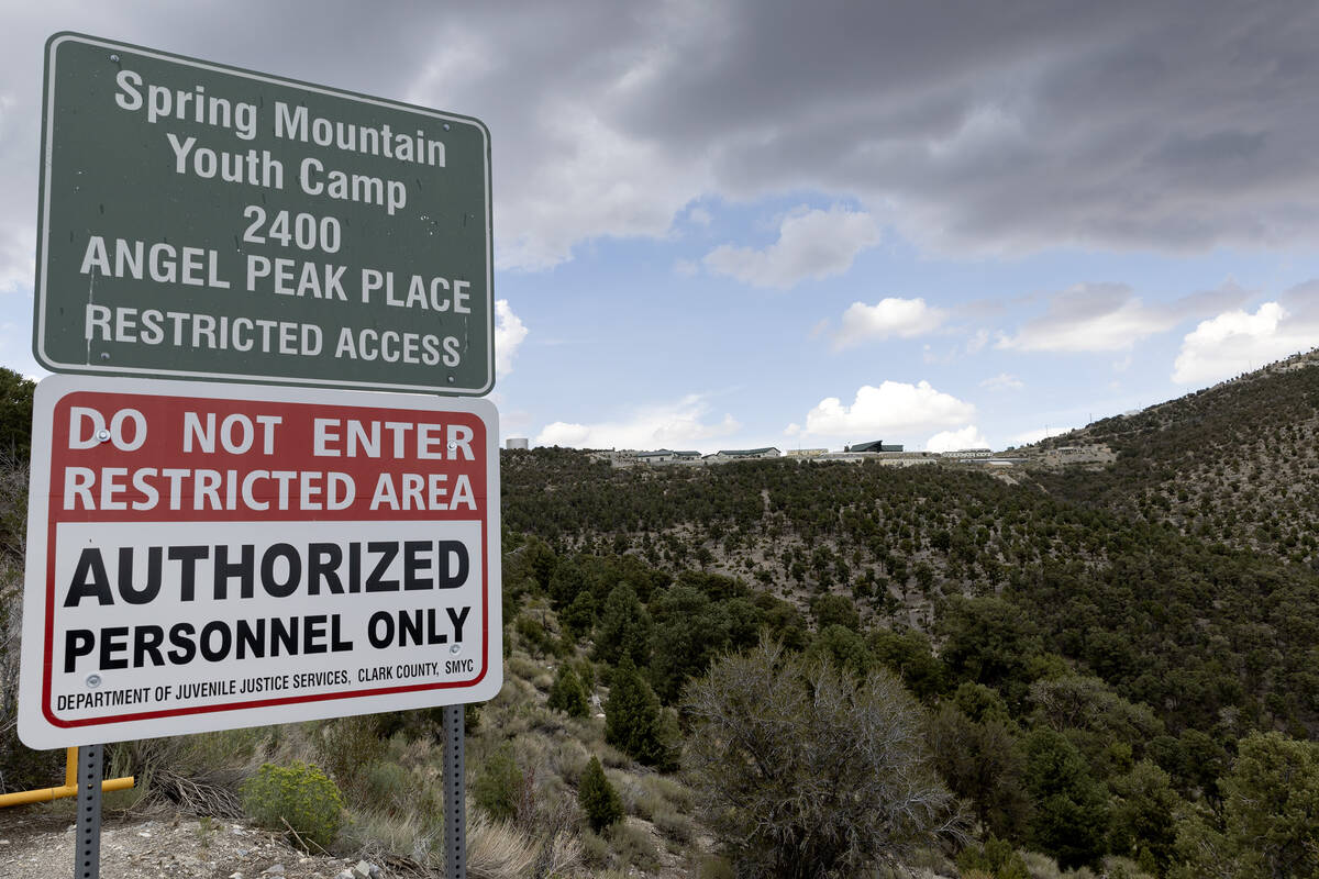 Signs mark the entrance of the Spring Mountain Youth Camp juvenile detention center on Wednesda ...