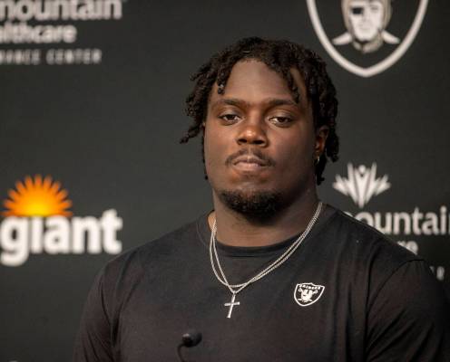 Raiders offensive guard Lester Cotton attends a news conference after the team’s trainin ...