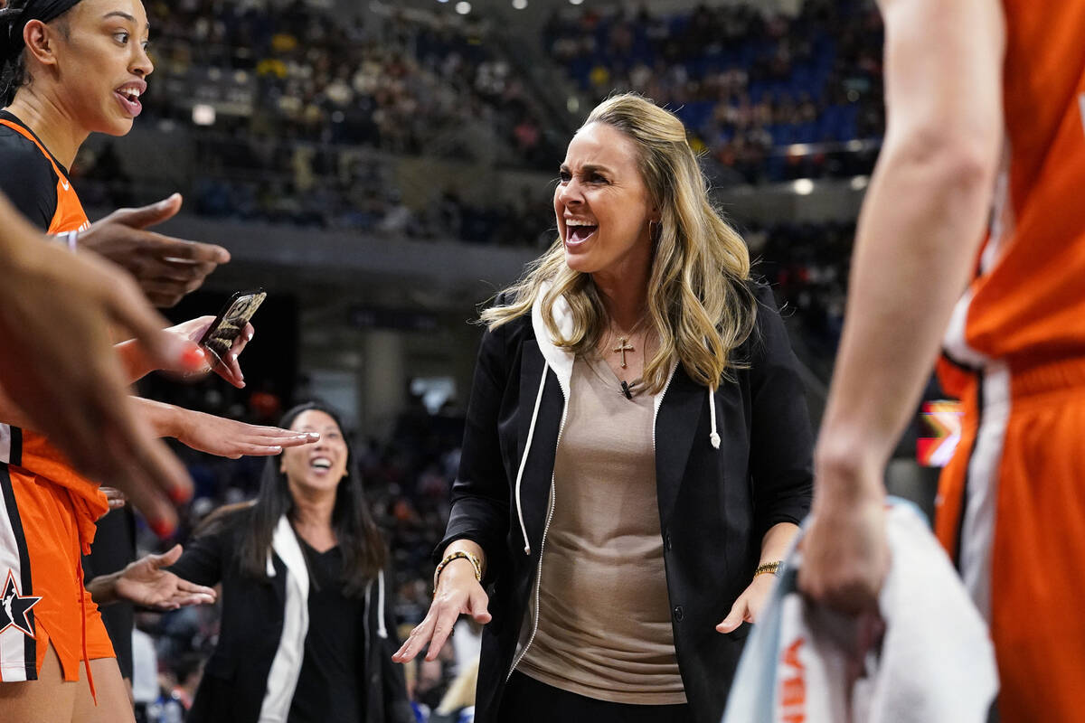 Team Wilson head coach Becky Hammon talks to players during the first half of a WNBA All-Star b ...