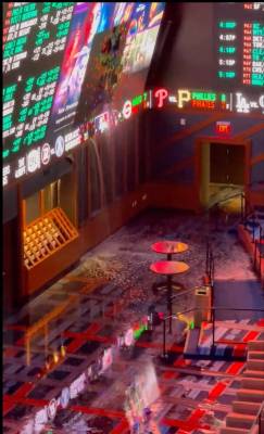 Water pours through the screen of the Circa sportsbook Thursday during a rainstorm. Screen shot ...