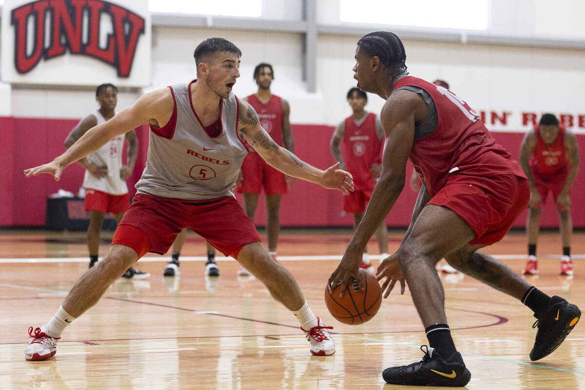 UNLV's Jordan McCabe (5) defends against Luis Rodriguez (15) during a team basketball practice ...