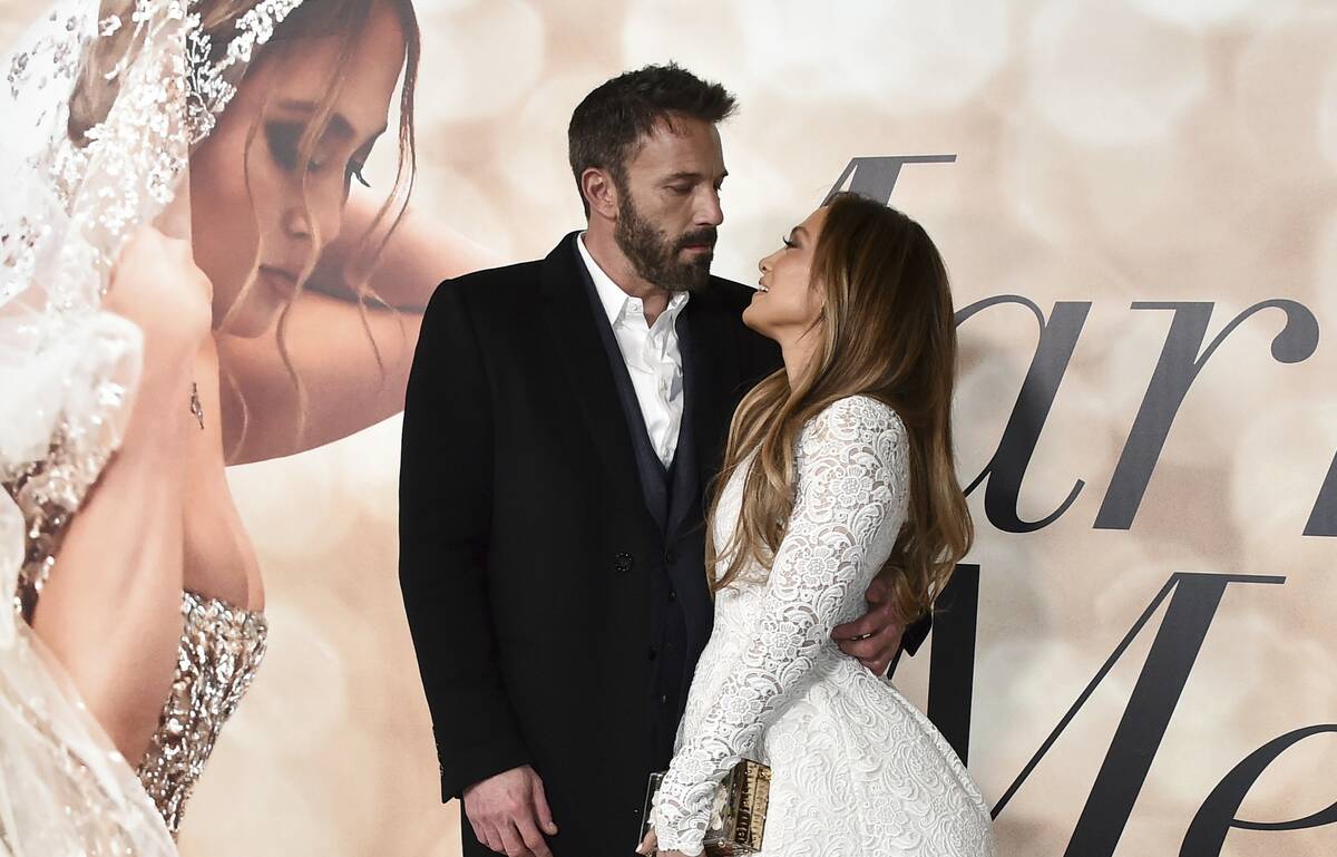 Jennifer Lopez, right, and Ben Affleck attend a photo call for a special screening of "Marry Me ...