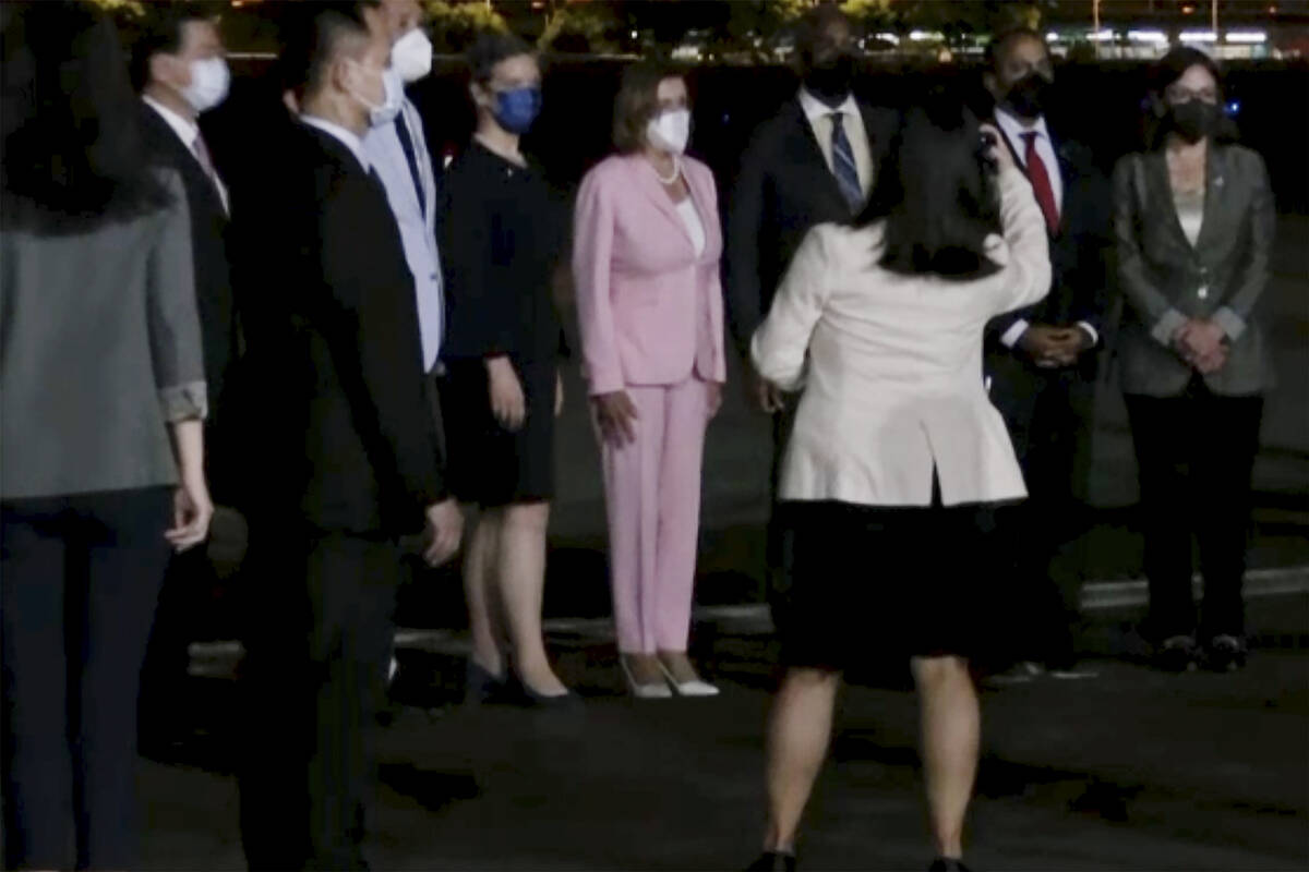 CORRECTS SOURCE: In this image taken from video, U.S. House Speaker Nancy Pelosi, center, arriv ...