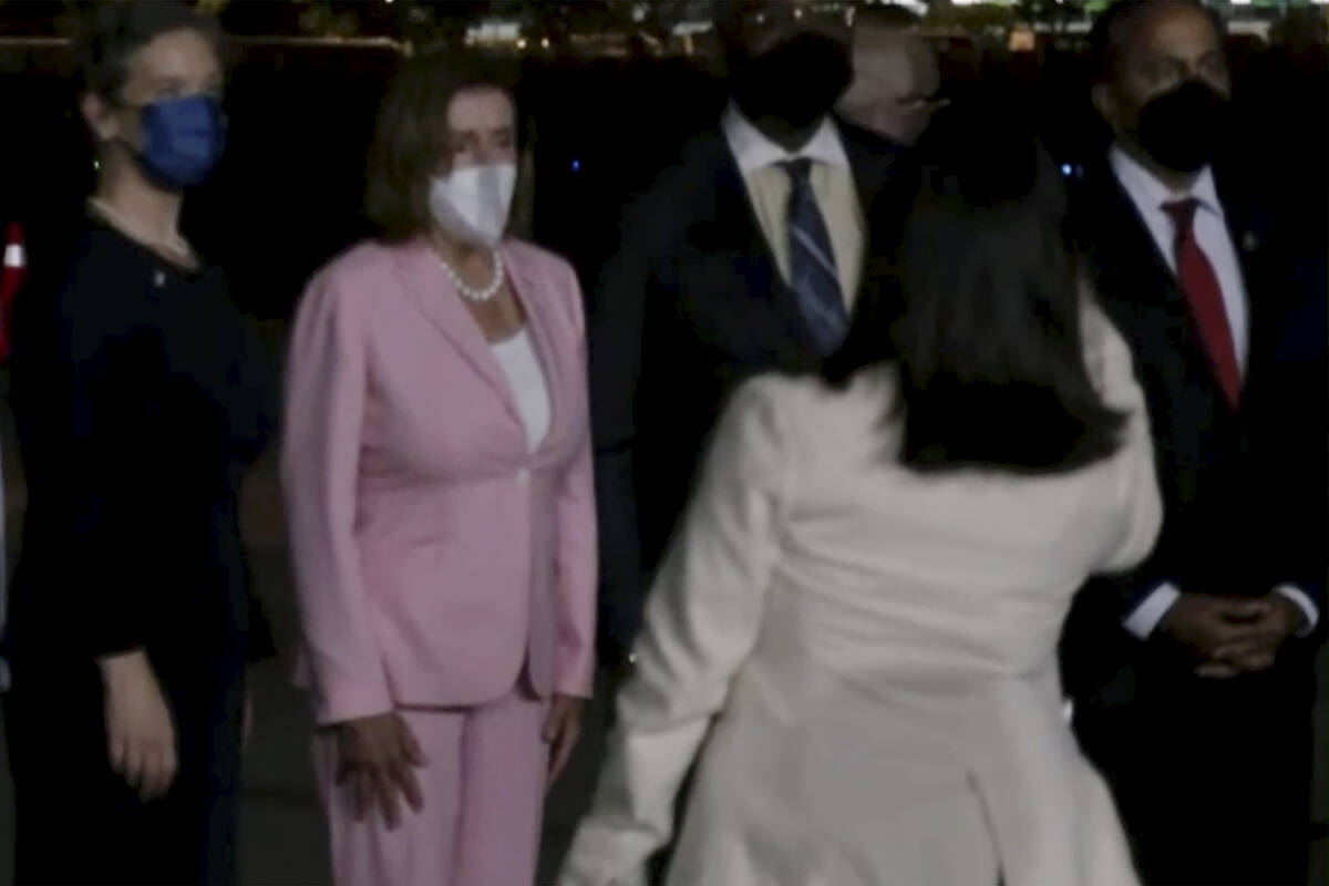 CORRECTS SOURCE: In this image taken from video, U.S. House Speaker Nancy Pelosi arrives in Tai ...