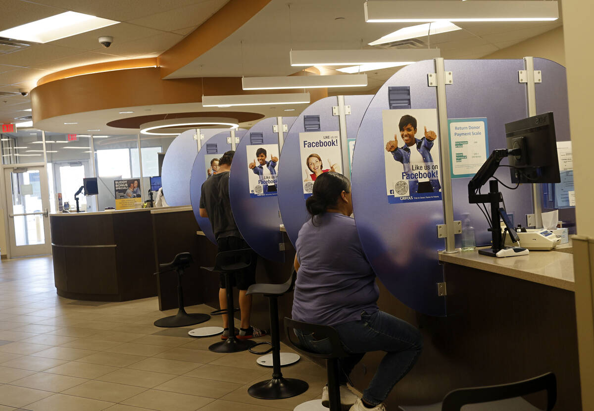 Plasma donors check blood pressure before they donate their plasma at the Grifols Biomat USA Pl ...