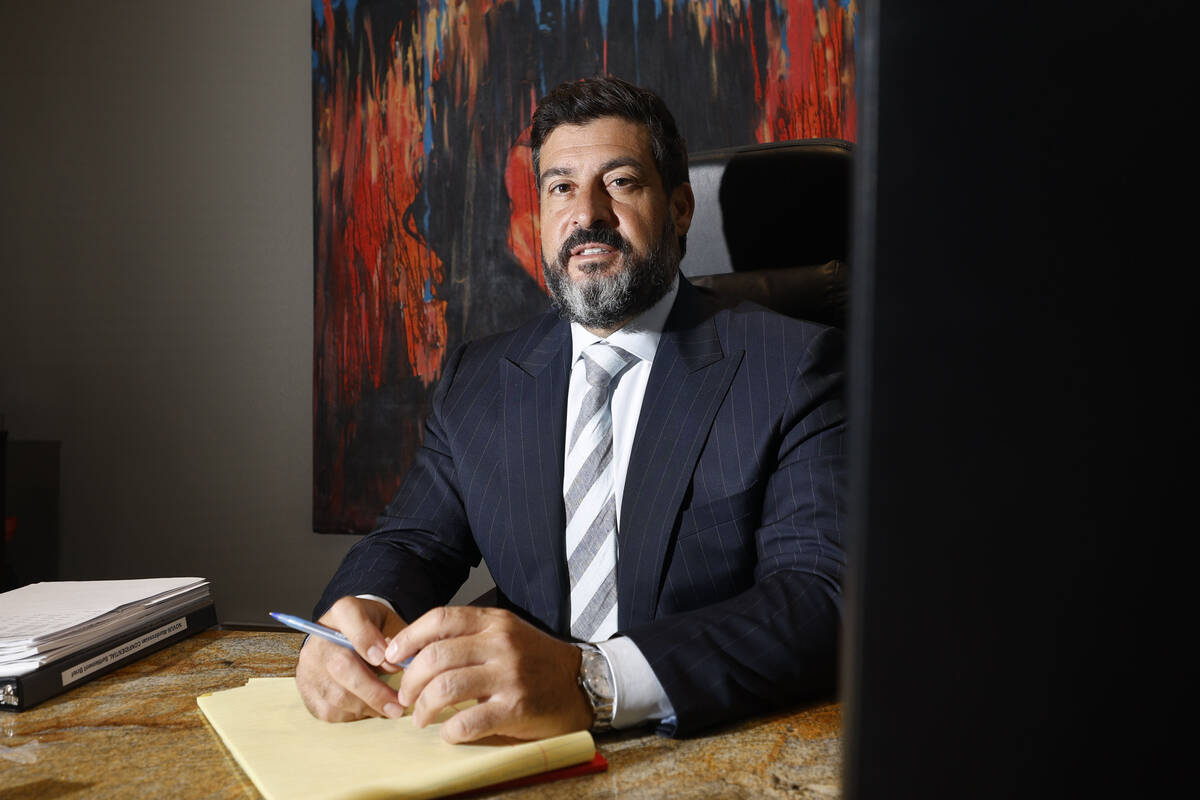 Attorney Michael Cristalli poses for a photo in his office, Thursday, Aug. 4, 2022, in Las Vega ...