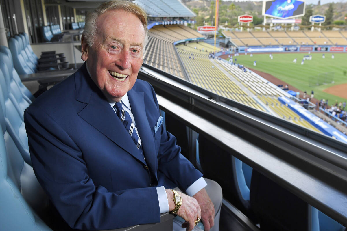 In this Tuesday, Sept. 20, 2016, photo, broadcaster Vin Scully poses for a photo prior a baseba ...