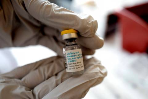 Registered pharmacist Sapana Patel holds a bottle of monkeypox vaccine at a pop-up monkeypox va ...