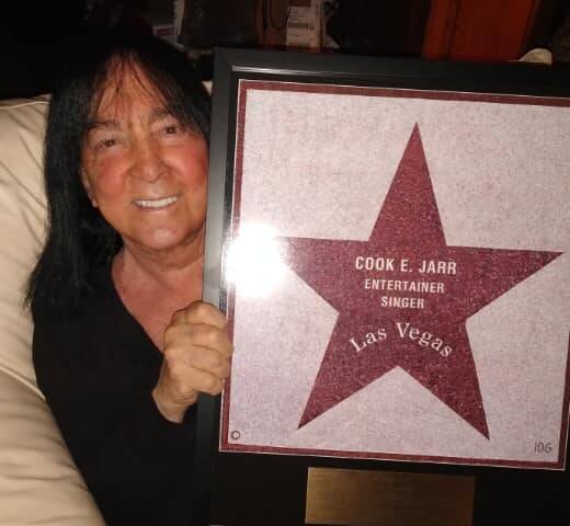 Vegas lounge legend Cook E. Jarr is shown with a framed replica of his Las Vegas walk of Stars ...