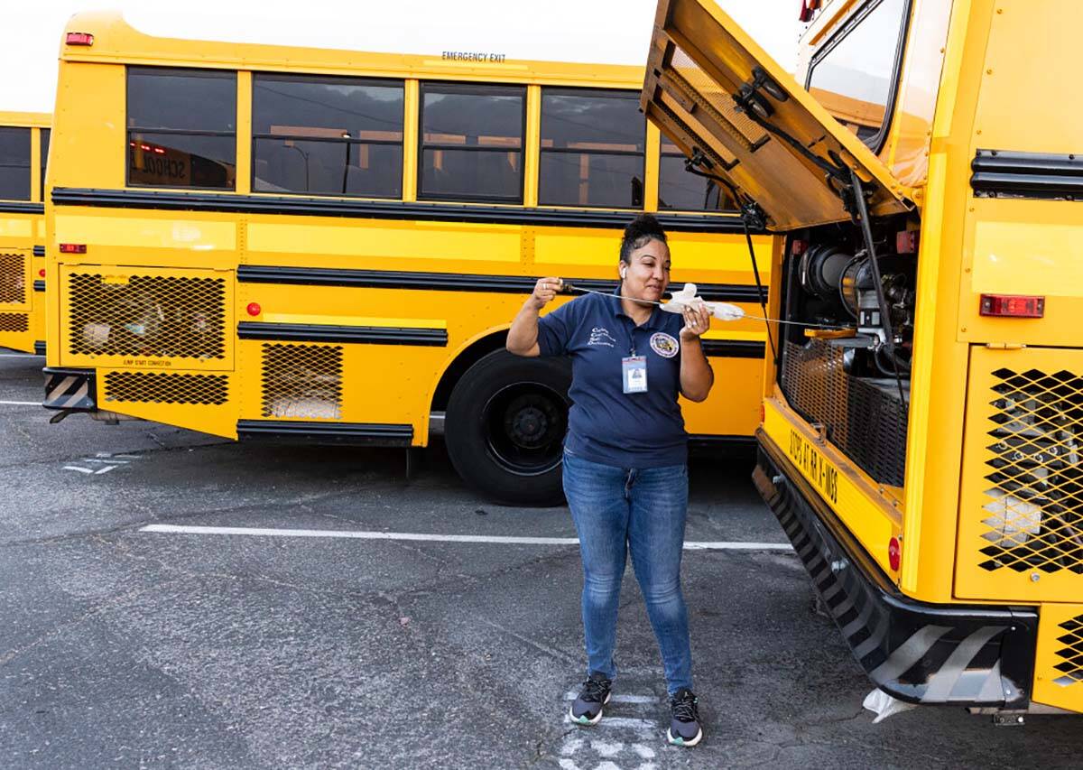 Stacee Lopez, a CCSD school bus driver, inspects her bus at the Arville Transportation Yard as ...