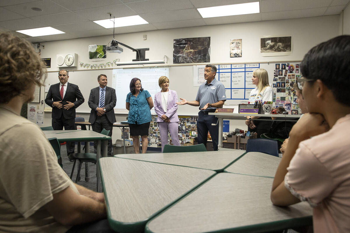 University of Nevada-Reno President Brian Sandoval, second from right, speaks to a class of stu ...