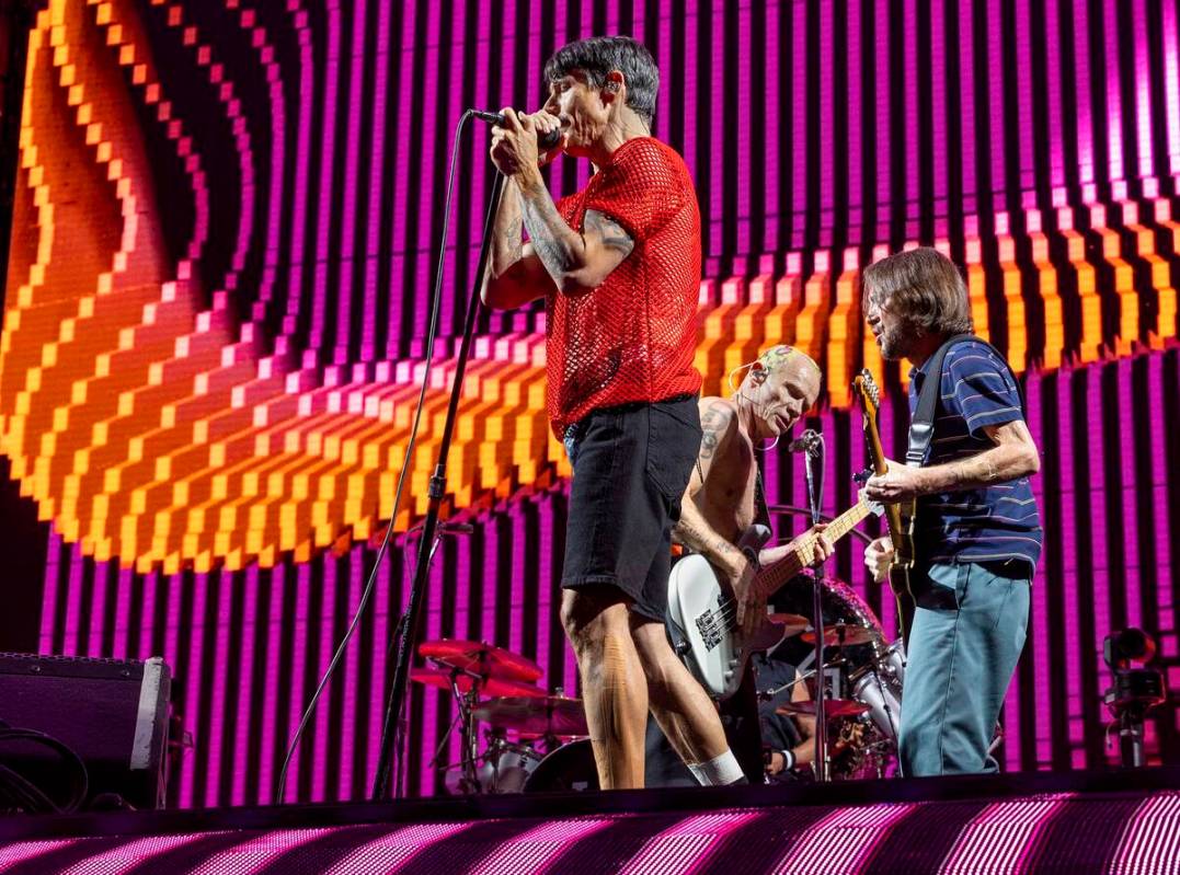 (From left) Lead singer Anthony Kiedis, Bassist Flea and lead guitar John Frusciante perform as ...