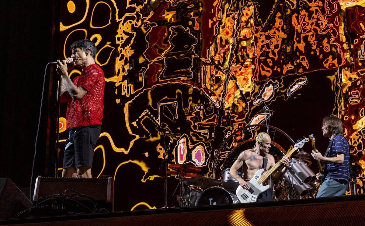 (From left) Lead singer Anthony Kiedis, Bassist Flea and lead guitar John Frusciante perform as ...