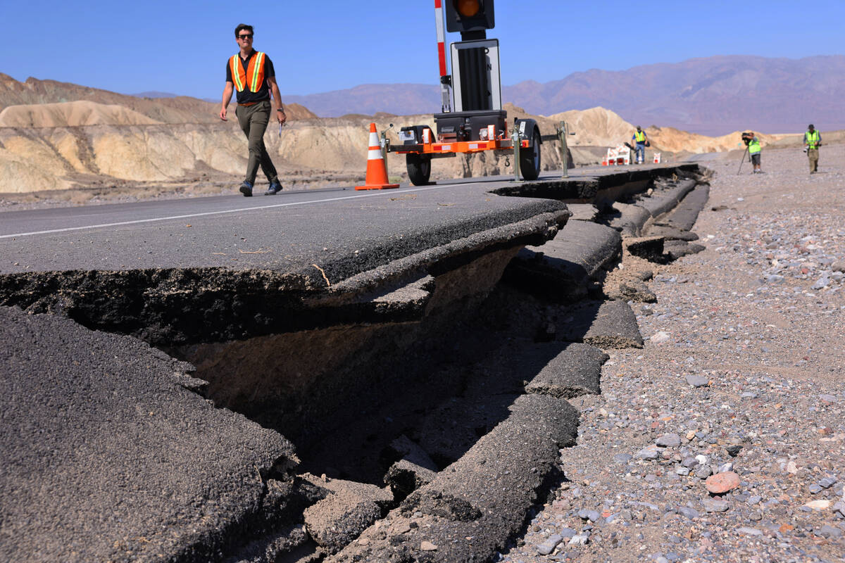 Damage on California State Route 190, a road into Death Valley National Park, is visible Thursd ...