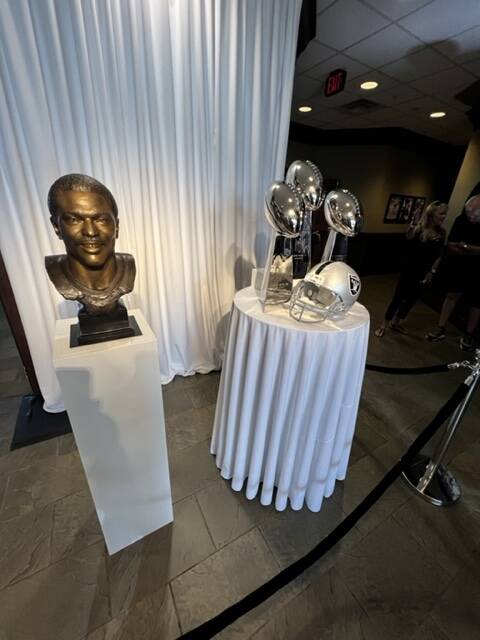 Cliff Branch's Pro Football Hall of Fame bust and the Raiders' Super Bowl trophies are shown at ...