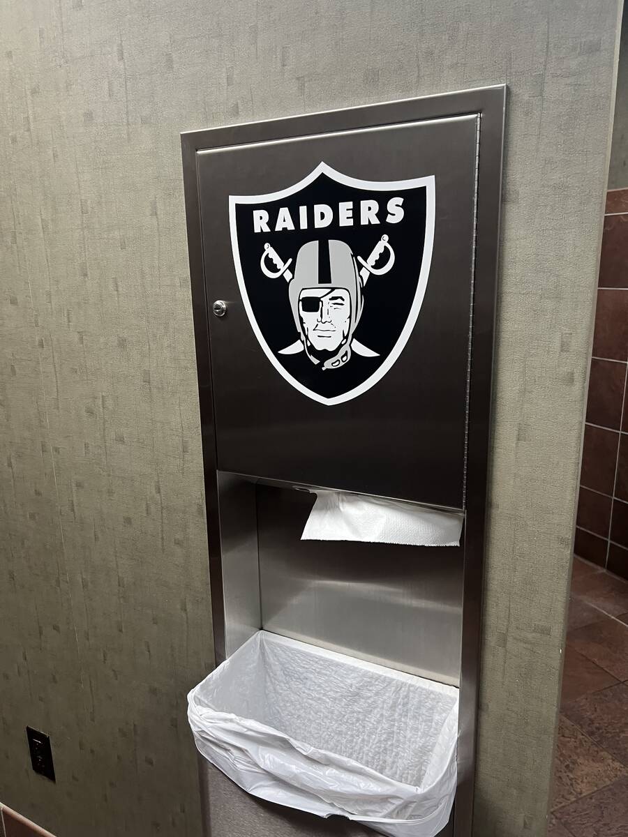 The Raiders' logo is shown in the men's room at the Raiders' party honoring Cliff Branch at Qua ...