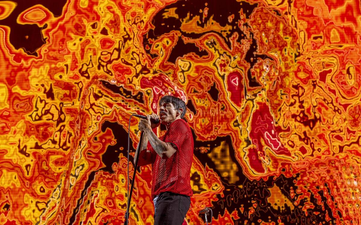 Lead singer Anthony Kiedis sings with The Red Hot Chili Peppers at Allegiant Stadium on Saturda ...