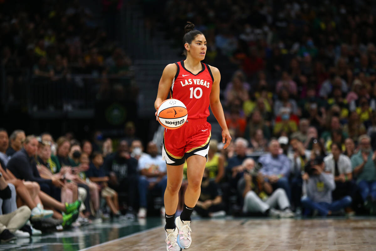 Kelsey Plum #10 of the Las Vegas Aces dribbles the ball during the game against the Seattle Sto ...