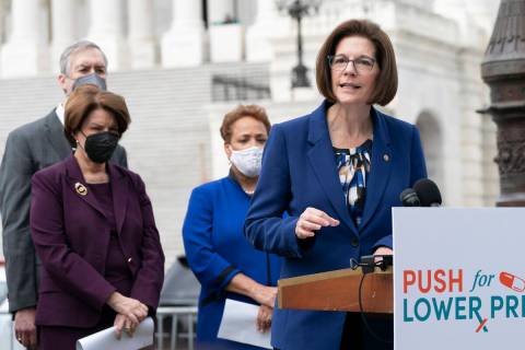 Sen. Catherine Cortez Masto, D-Nev., right, speaks at a news conference Tuesday, April 26, 2022 ...