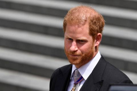 FILE - Britain's Prince Harry leaves after attending a service of thanksgiving for the reign of ...