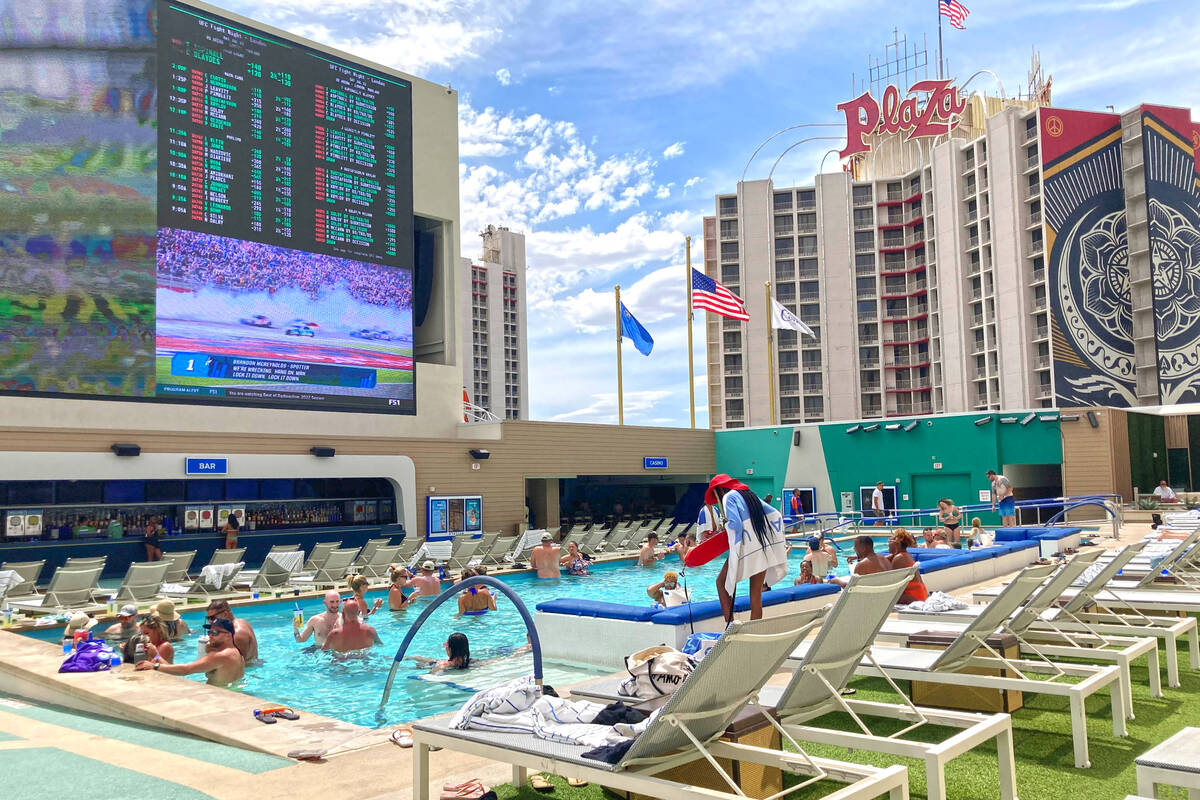 A lifeguard watches over a group of pool-goers at Circa Resort's Stadium Swim on July 22, 2022. ...