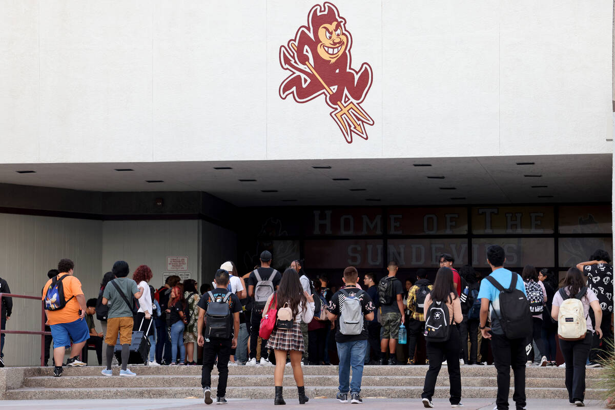 Students arrive at a single point of entry for the first day of the school year at Eldorado Hig ...