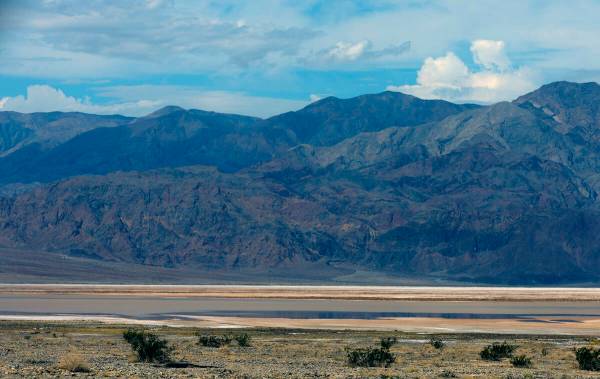 Water collects into a large pond about the lowest part of Death Valley National Park off on Sta ...