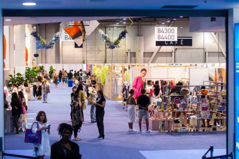People walk around during the MAGIC Las Vegas fashion trade show on Monday, Aug. 8, 2022, at th ...