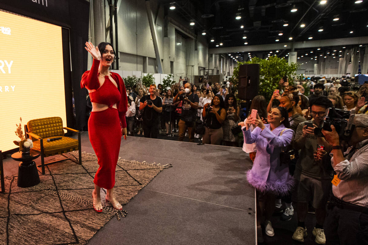 Katy Perry poses after speaking during the MAGIC Las Vegas fashion trade show on on Tuesday, Au ...