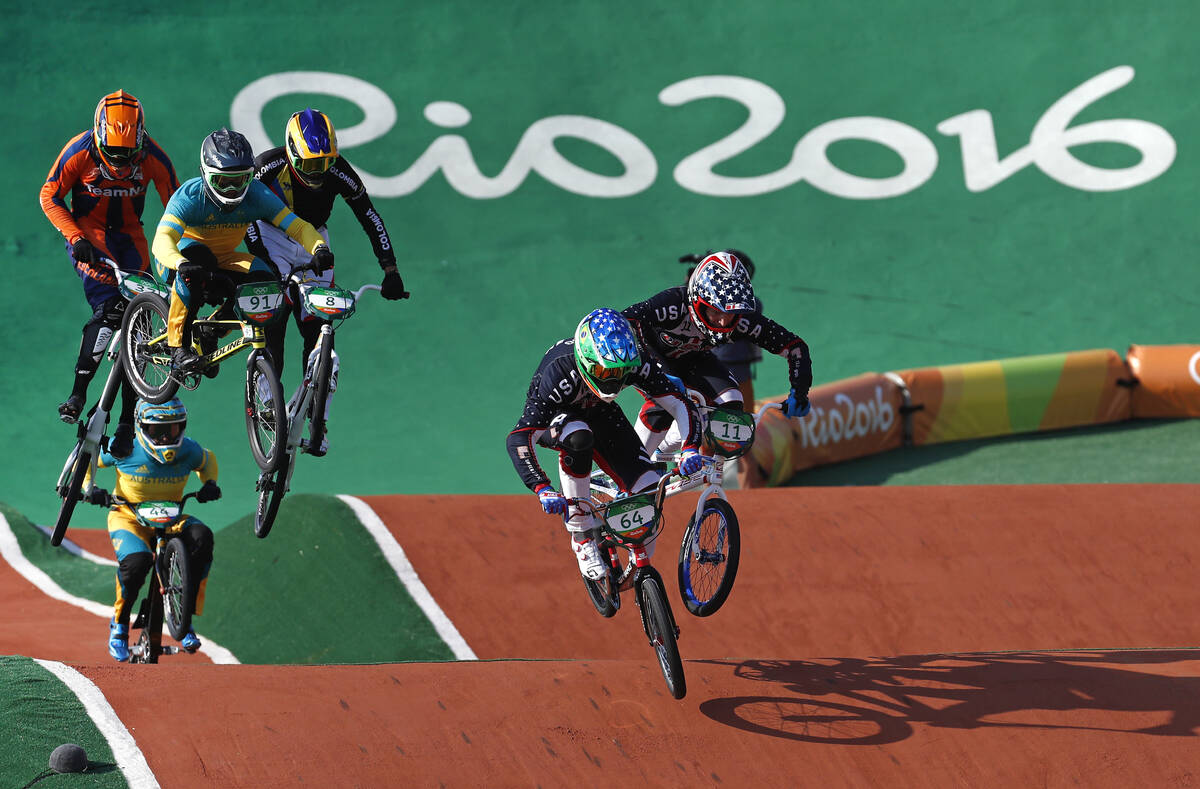 Nicholas Long (64) and Connor Fields (11) of the United States lead the pack as they compete in ...