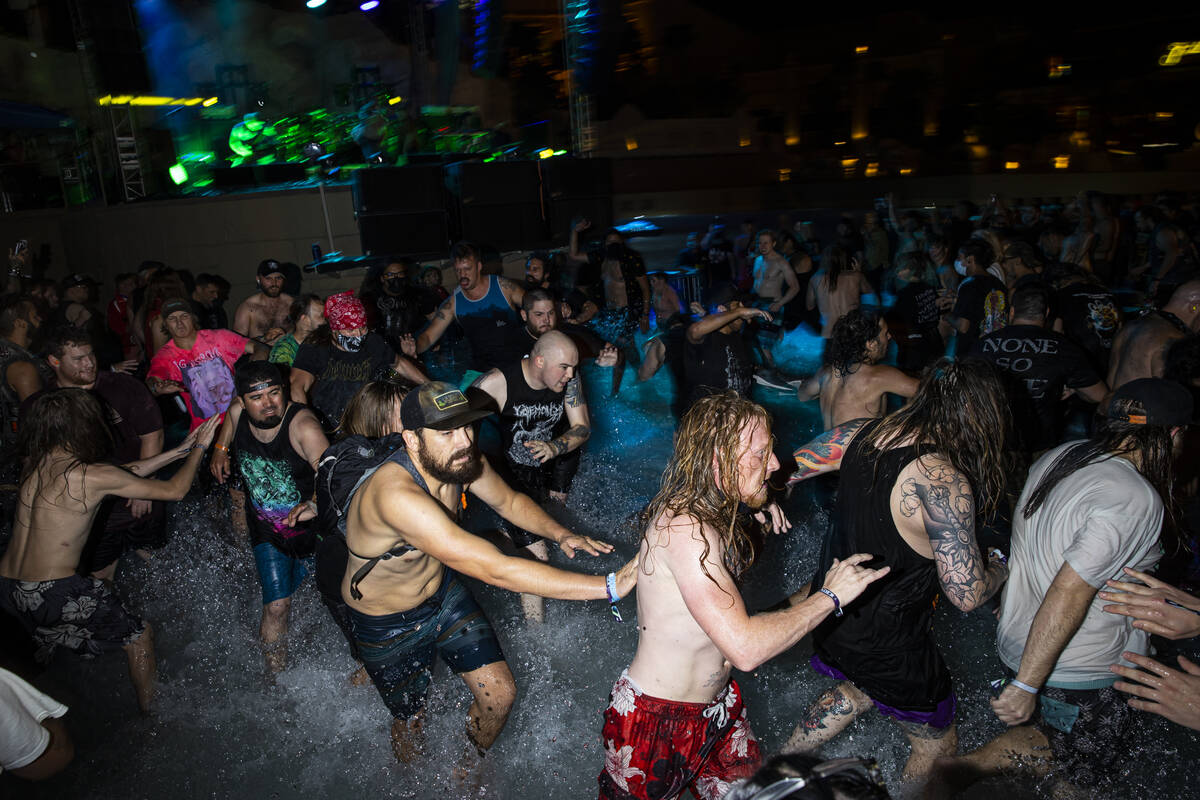 People mosh in the water at the beach stage as Pig Destroyer performs during Psycho Las Vegas a ...