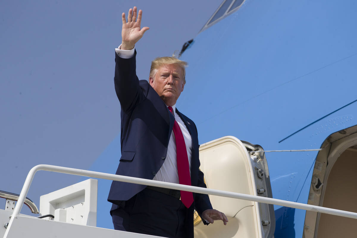 Donald Trump waves as he walks to Air Force One as he departs Thursday, Aug. 1, 2019, at Andrew ...