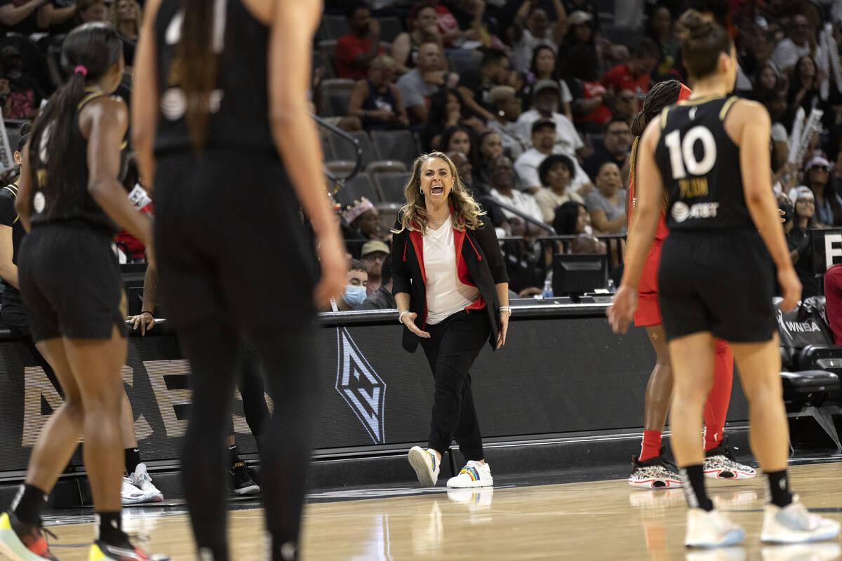 Las Vegas Aces head coach Becky Hammon cheers for her team during the first half of a WNBA bask ...