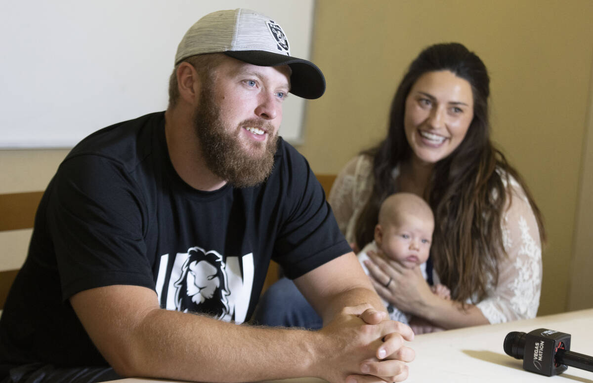 Raiders long snapper Trent Sieg, left, his wife Carly Sieg, right, and their three-month-old so ...