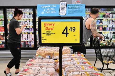 People shop at a grocery supermarket in Alhambra, California, on July 13, 2022. (Frederic J. Br ...
