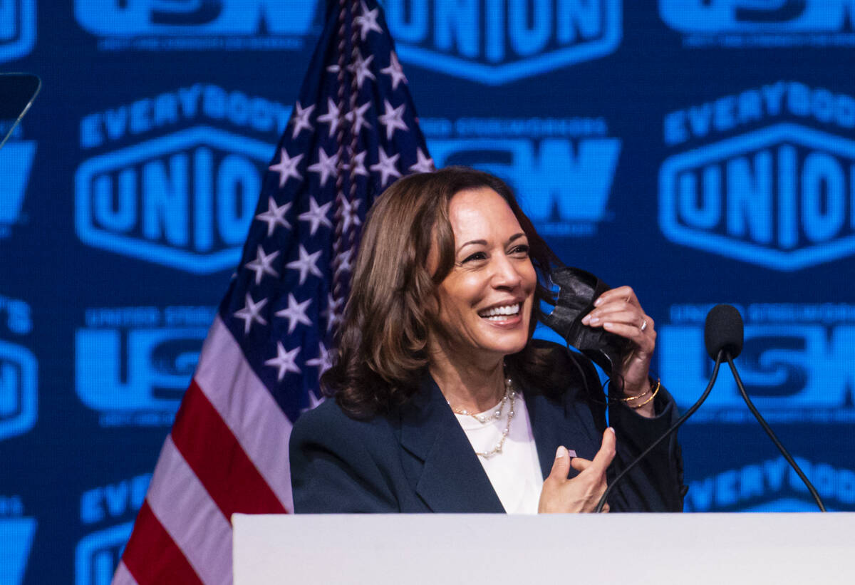 Vice President Kamala Harris takes off her face mask before speaking at a United Steelworkers c ...