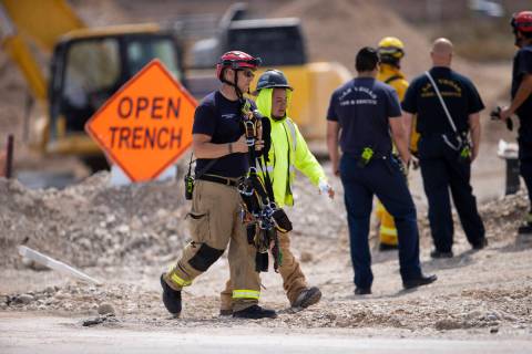 Las Vegas police and firefighters from various agencies respond to a workplace fatality at a co ...