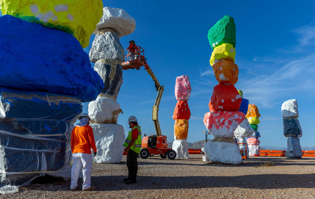 A crew from the Vergith Contracting Co. prepares the stones at Seven Magic Mountains as the art ...