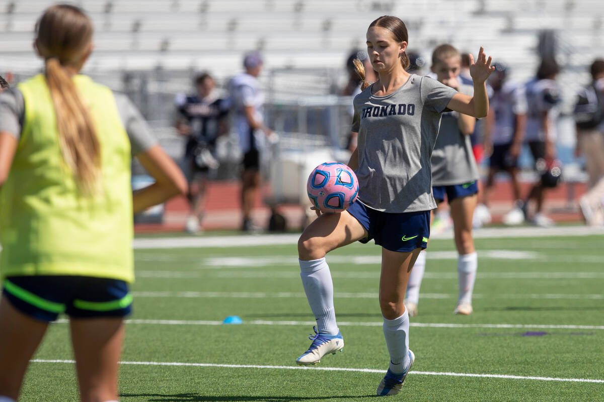 Trinity Buchanan controls the ball during a drill at Coronado High School's girls soccer practi ...