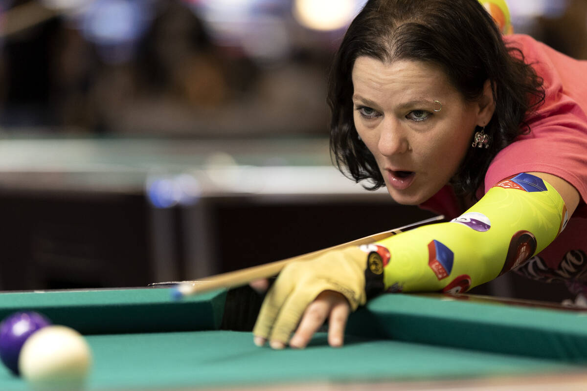 Maya Dull, of Pennsylvania, reacts to her shot during the American Poolplayers Association Worl ...