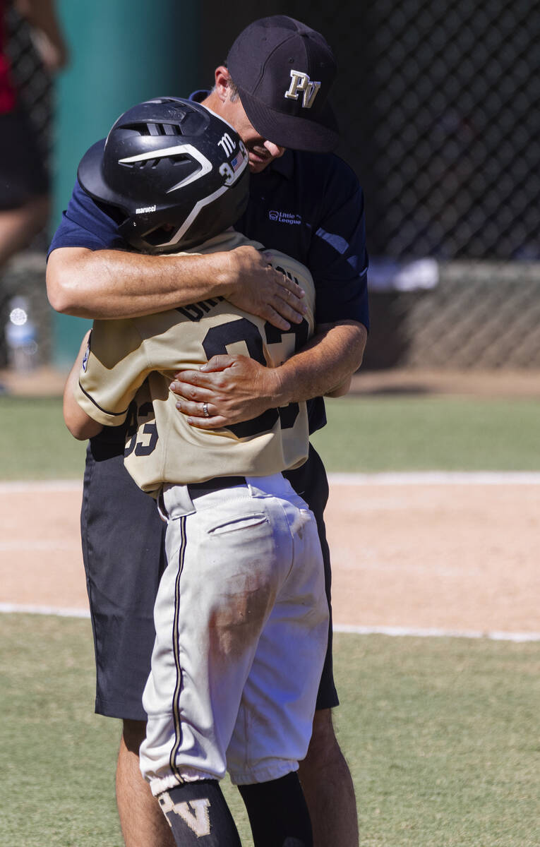 Paseo Verde's assistant coach Brian Gregorich console his son Ryland Gregorich (33) after losin ...