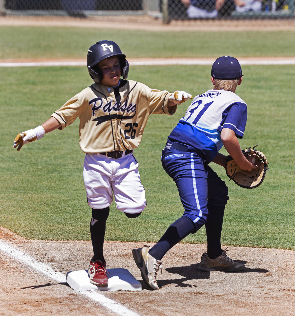 Paseo Verde's second baseman Caden Cadaver (26) is forced out by Utah-Snow Canyon's first base ...