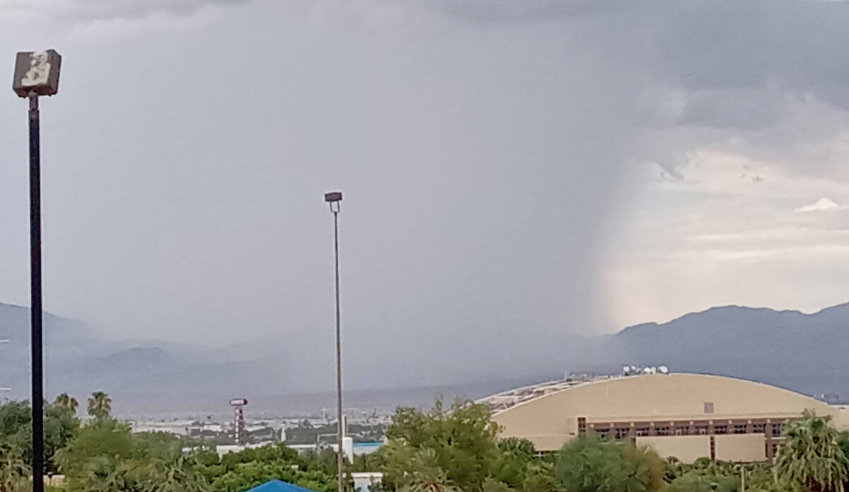 A storm cell drops rain on northeast Las Vegas about 2:45 p.m. Friday, Aug. 12, 2022. One gauge ...