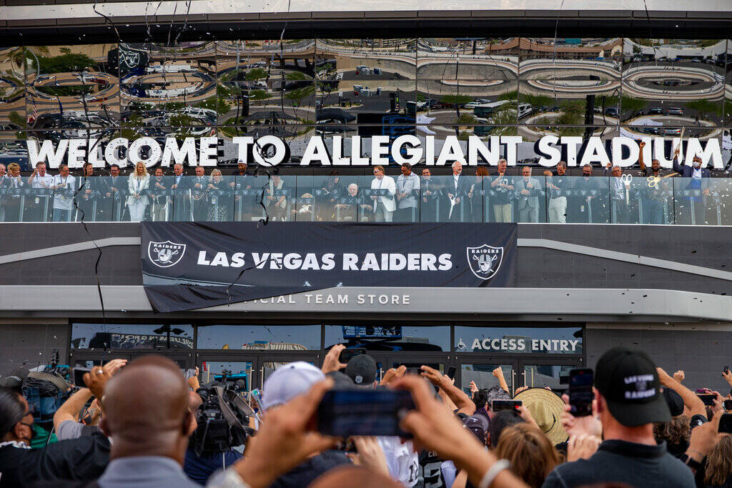 Invited dignitaries join Raiders owner Mark Davis before fans during the official ribbon cuttin ...