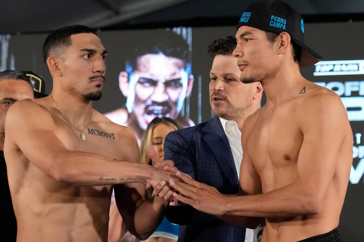 Pedro Campa, right, and Teofimo Lopez shake hands during a weigh-in for their junior welterweig ...